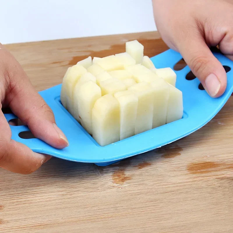 ABC Steel Potato Chip Cutter Chipper in blue slicing potatoes into chips on a wooden board.